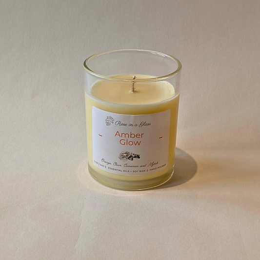Pure essential oil Amber Glow soy candle in reusable glass to calm busy minds and find focus