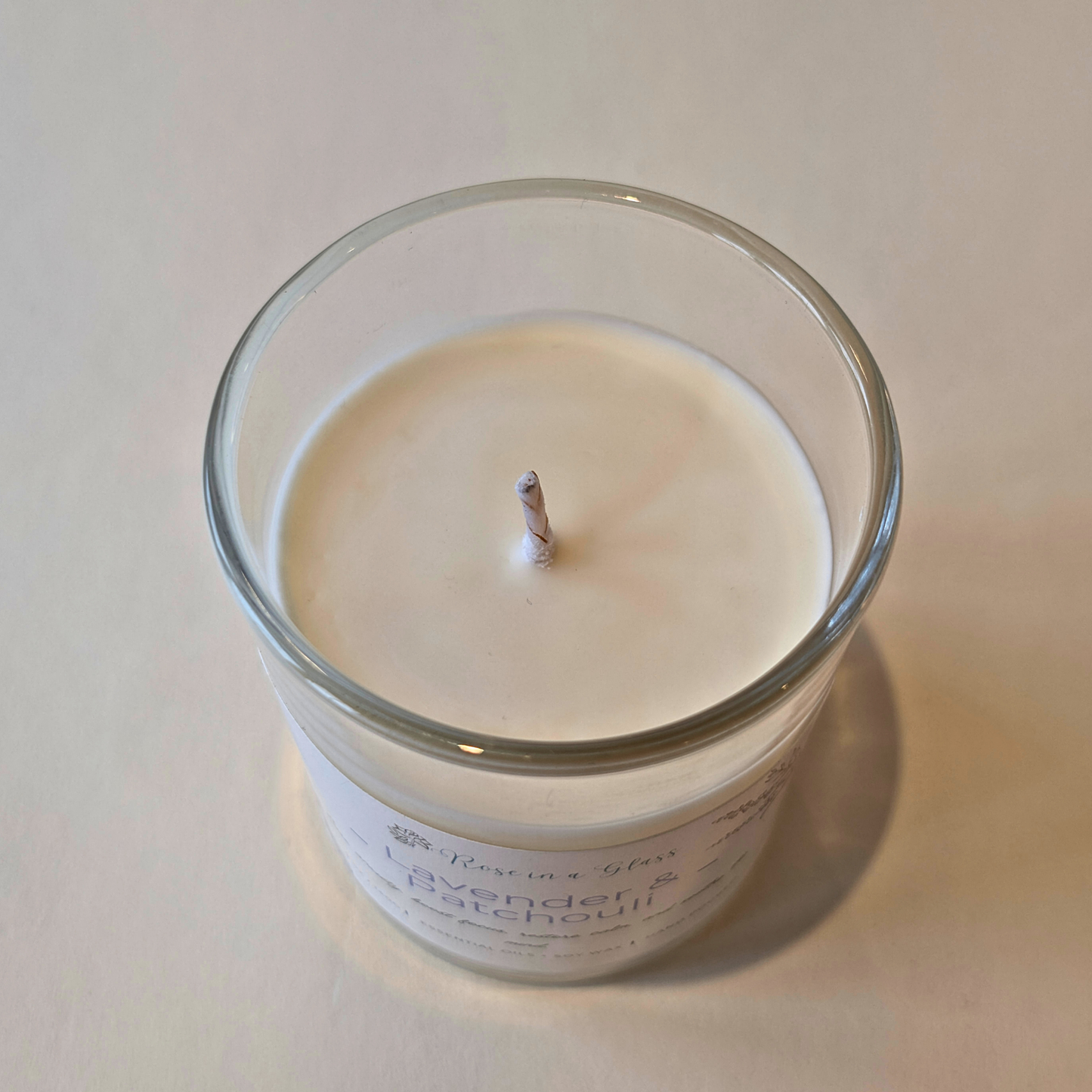 Close up of Lavender and Patchouli candle's non toxic soy wax hand poured in Hampshire to help find calm focus and tranquility