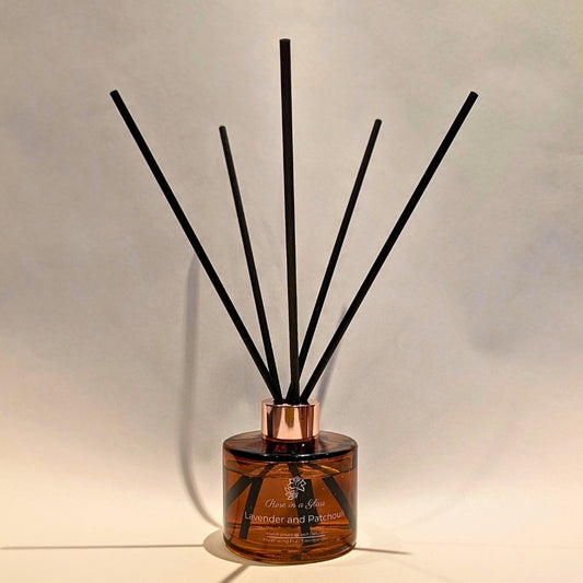 Botanical Lavender and Patchouli reed diffuser with black fibre reeds for continuous aromatherapy wellness and busy mind sensory support