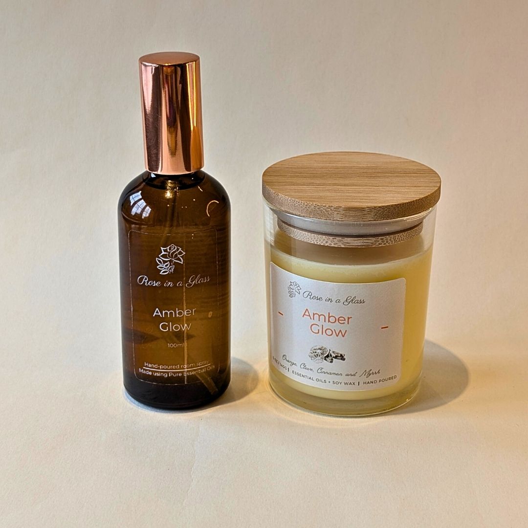 Matching Amber Glow candle and spray gift set in reusable glass for aromatherapy wellness