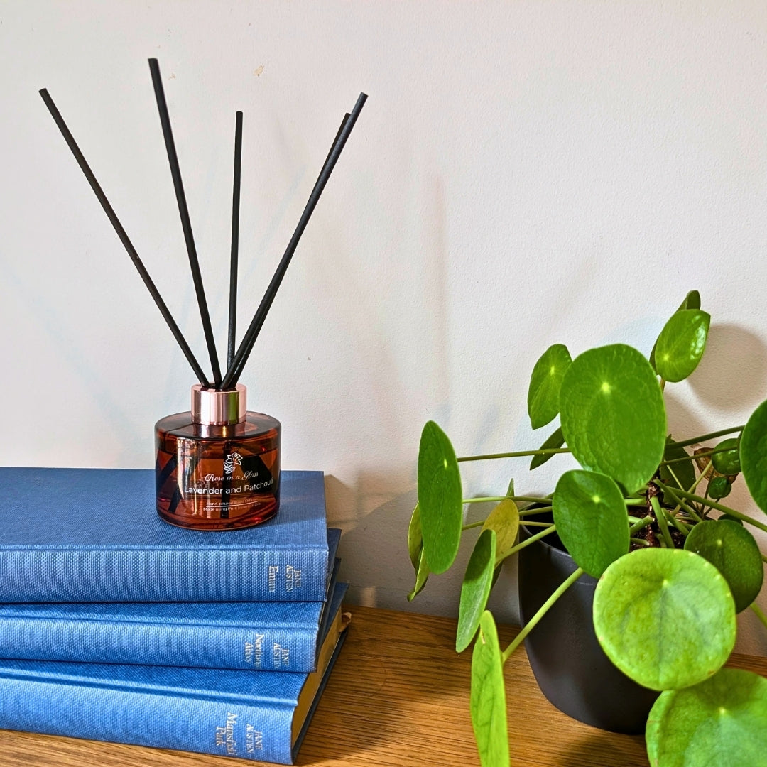 Lavender and Patchouli Aromatherapy reed diffuser on classic literature books for a tranquil home environment
