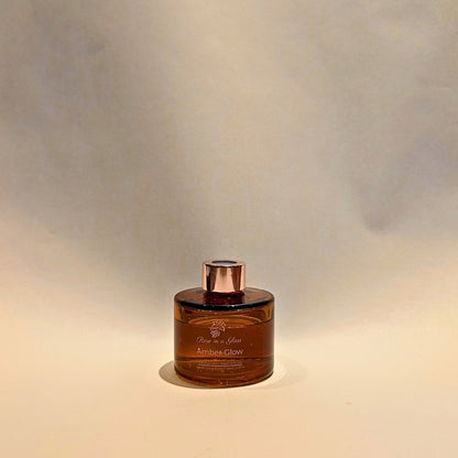 Pure essential oil Amber Glow reed diffuser to find calm focus and tranquillity in overstimulating spaces