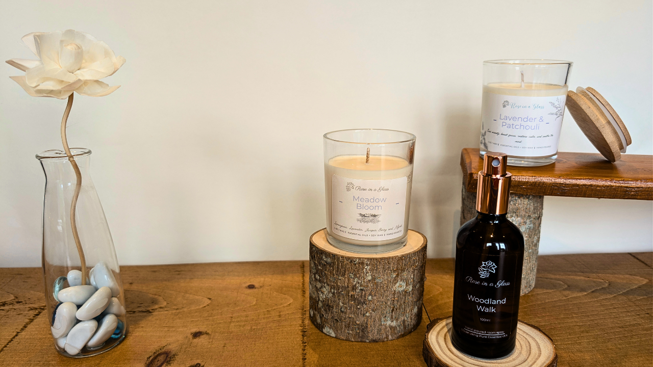 aromatherapy candles and roomspray in rustic setting designed to soothe the senses, busy minds, and bring tranquility